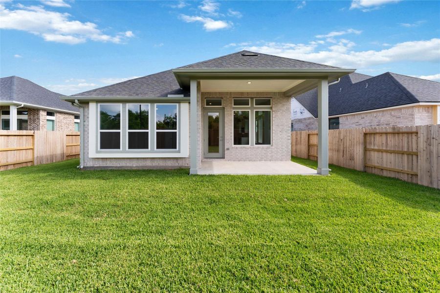 Exterior details and patio area of a home in Ellwood, Iowa Colony (Image 3).