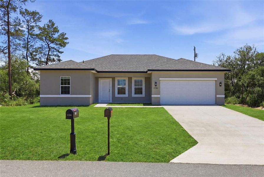 Front exterior of a new home in , Ocala, FL, highlighting curb appeal (Image 26).