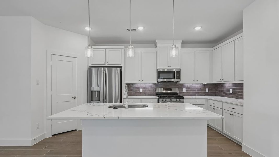 Furnished interior view inside a new home in Meridiana Townhomes, Iowa Colony (Image 6).