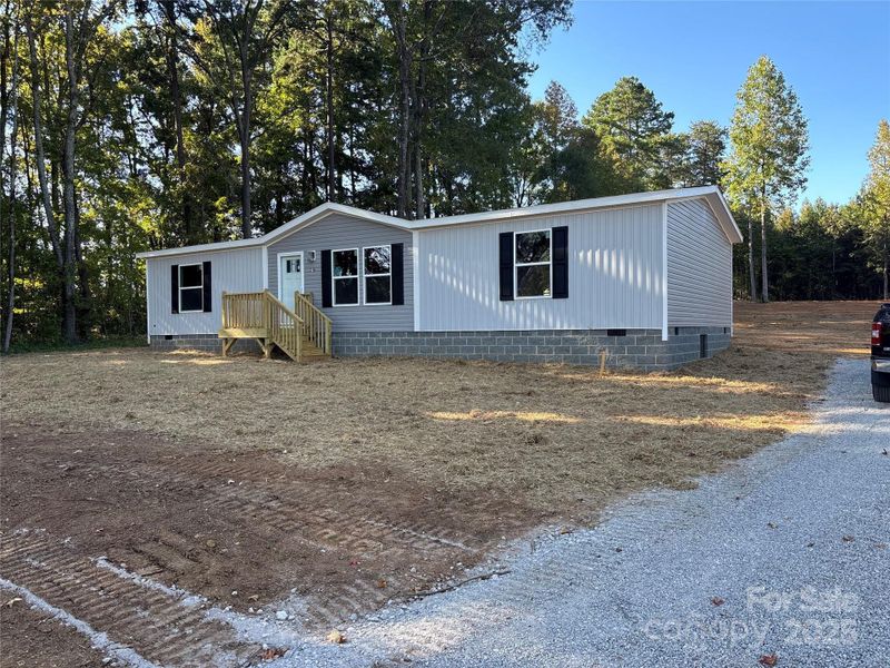 Front exterior of a new home in , Rockwell, NC, highlighting curb appeal (Image 15).