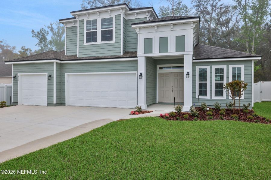 Front exterior of a new home in Jennings Farm, Middleburg, FL, highlighting curb appeal (Image 2). Front exterior of a new home in Jennings Farm, Middleburg, FL, highlighting curb appeal (Image 2).