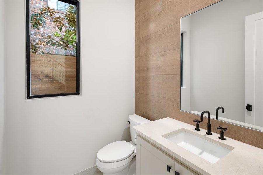 Bathroom featuring vanity and toilet