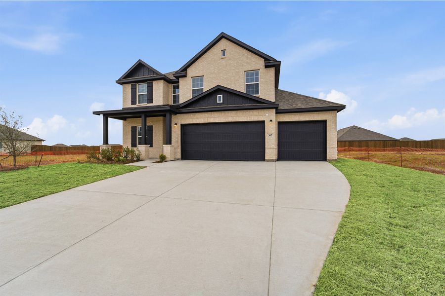 Front exterior of a new home in Saddlebrook Estates, Waxahachie, TX, highlighting curb appeal (Image 18).