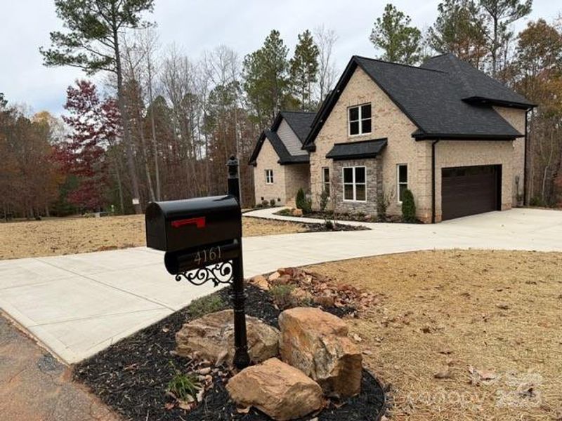 Front exterior of a new home in , Lincolnton, NC, highlighting curb appeal (Image 2).