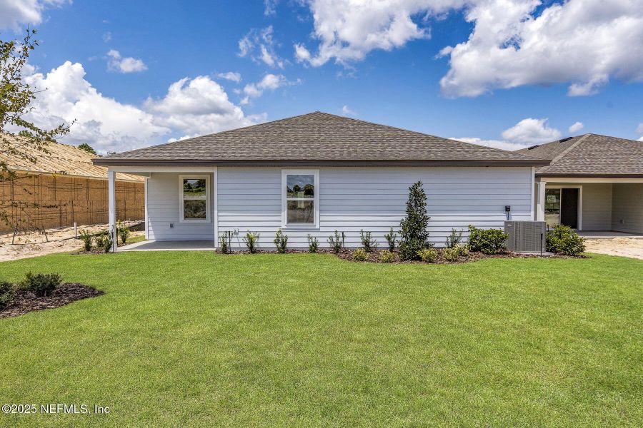 Front exterior of a new home in Rolling Hills, Green Cove Springs, FL, highlighting curb appeal (Image 18). Front exterior of a new home in Rolling Hills, Green Cove Springs, FL, highlighting curb appeal (Image 18).