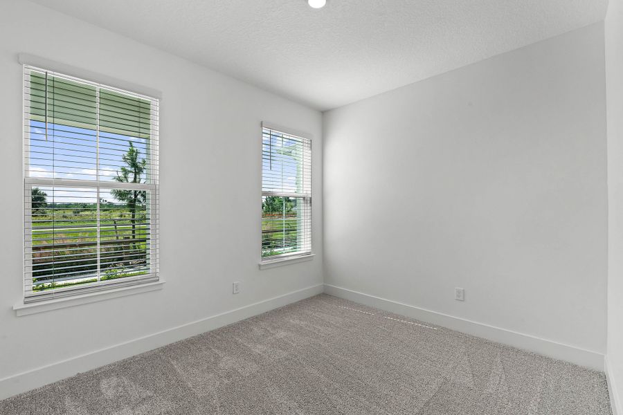 Spacious, unfurnished interior of a new home in Harvest at Ovation - Townhomes, Winter Garden (Image 18).