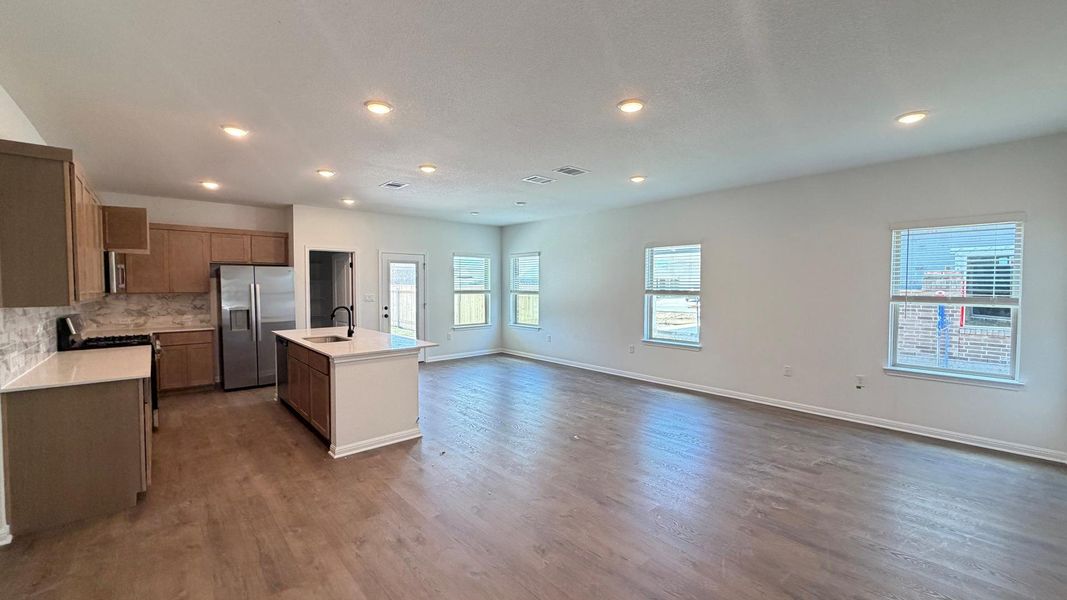 An open-concept living space integrates a well-appointed kitchen with an inviting living area, perfect for daily life. An open-concept living space integrates a well-appointed kitchen with an inviting living area, perfect for daily life.