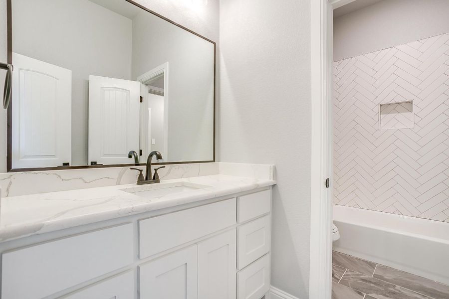 Representative furnished interior of a home built from the Pecan Grove by Trinity Classic Homes in The Reserve at Shadle, Poolville (Image 17). Representative furnished interior of a home built from the Pecan Grove by Trinity Classic Homes in The Reserve at Shadle, Poolville (Image 17).