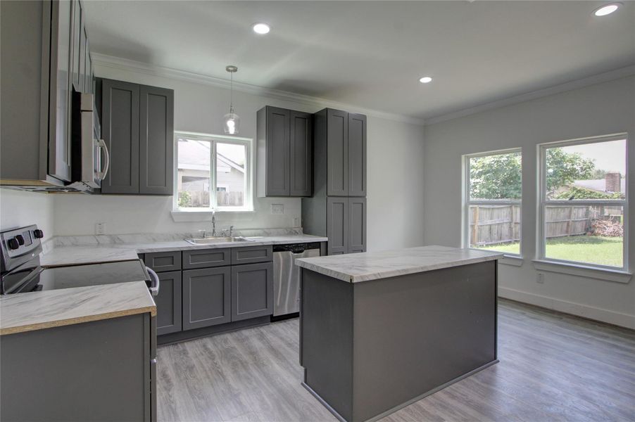 The large windows throughout the home provide an abundant of natural light. The large windows throughout the home provide an abundant of natural light.