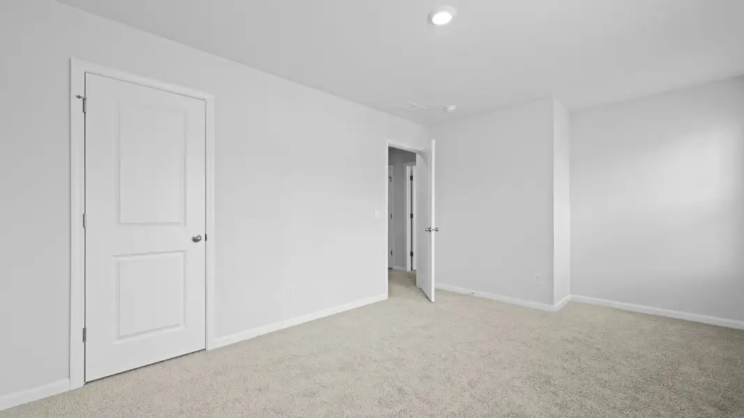 Spacious, unfurnished interior of a new home in Pine Hills Townhomes at Cane Bay, Summerville (Image 22). Spacious, unfurnished interior of a new home in Pine Hills Townhomes at Cane Bay, Summerville (Image 22).