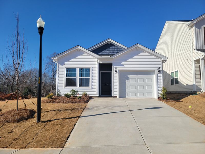 Front exterior of a new home in Mayfair Village, Spartanburg, SC, highlighting curb appeal (Image 1). Front exterior of a new home in Mayfair Village, Spartanburg, SC, highlighting curb appeal (Image 1).