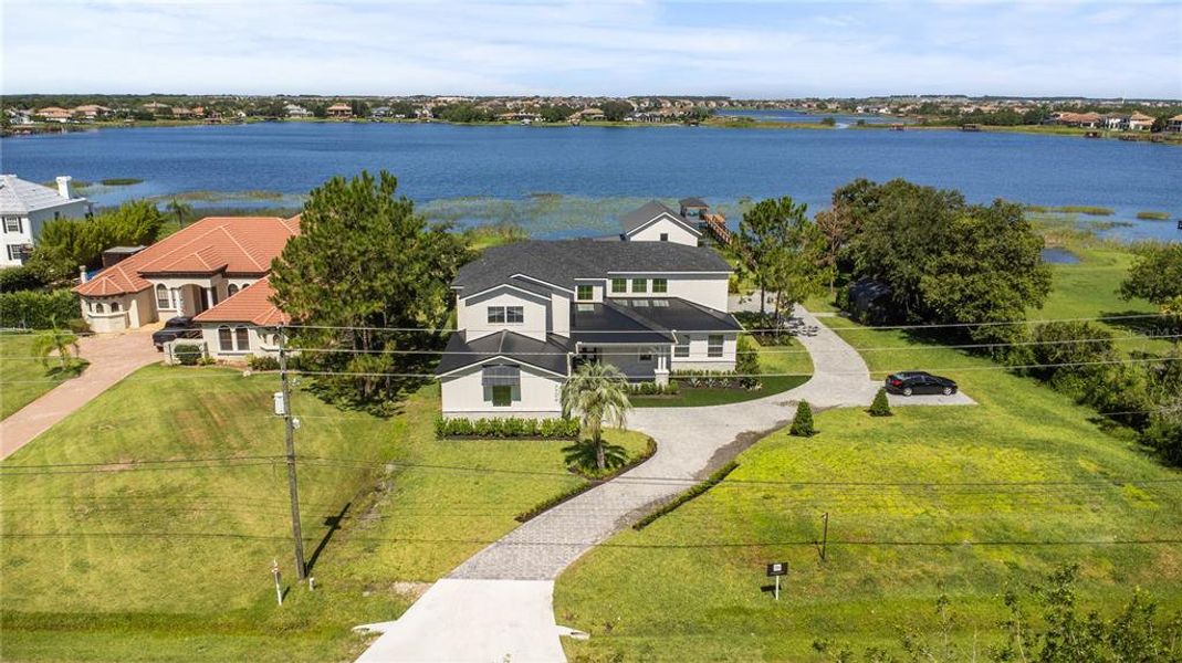 Front exterior of a new home in Windermere, Windermere, FL, highlighting curb appeal (Image 26).