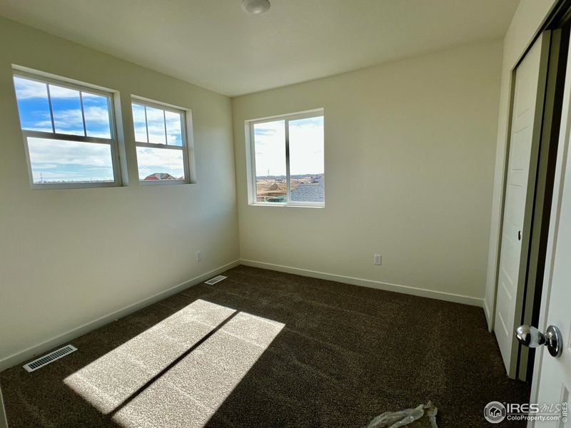 Spacious, unfurnished interior of a new home in Union Colony West, Greeley (Image 10).