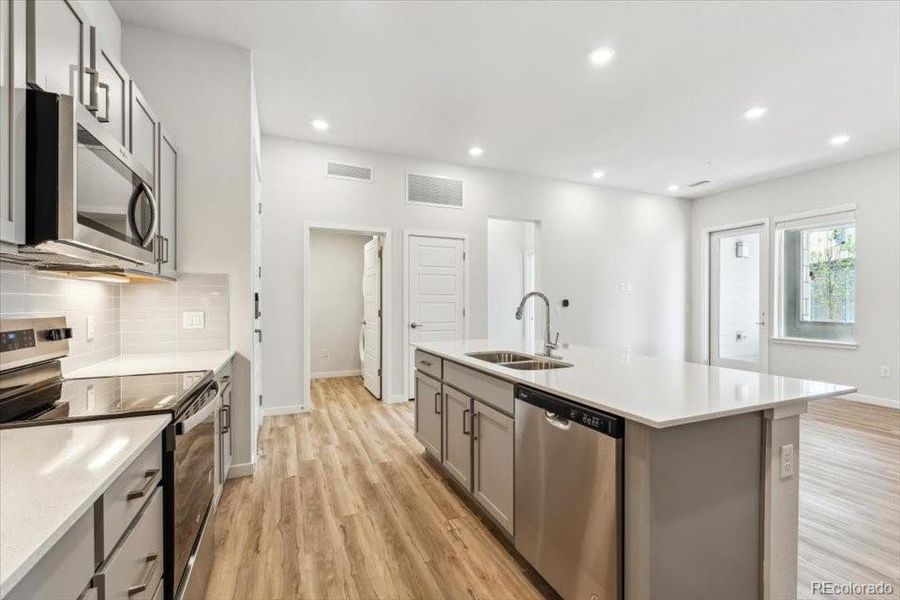 Furnished interior view inside a new home in Condo Collection at Grand Vue at Interlocken, Broomfield (Image 5).