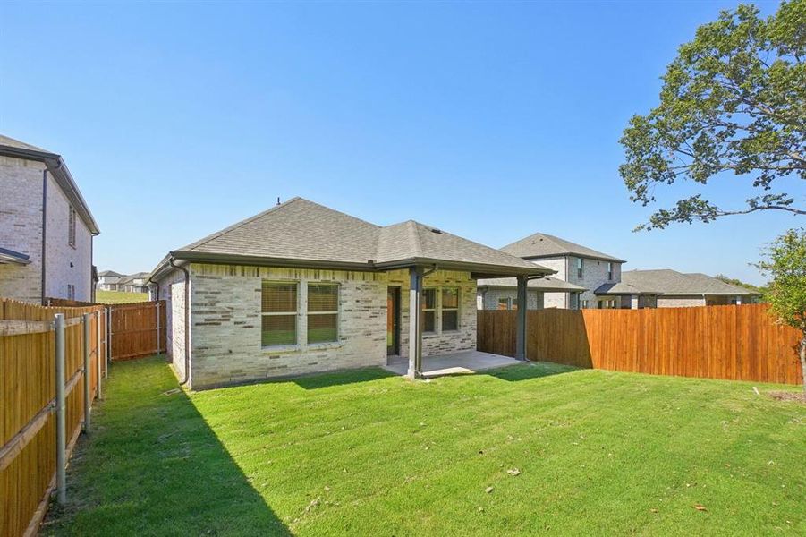 Exterior details and patio area of a home in Eastridge - Spring Series, McKinney (Image 3). Exterior details and patio area of a home in Eastridge - Spring Series, McKinney (Image 3).