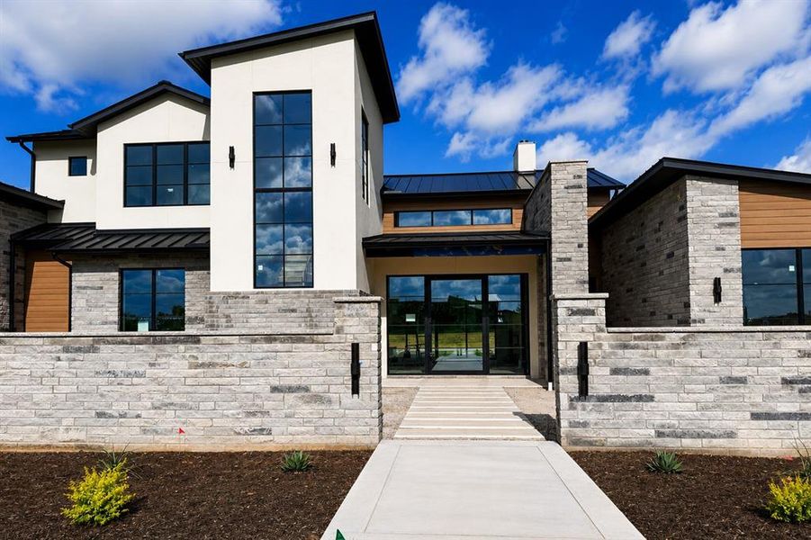 Front exterior of a new home in , Argyle, TX, highlighting curb appeal (Image 2). Front exterior of a new home in , Argyle, TX, highlighting curb appeal (Image 2).