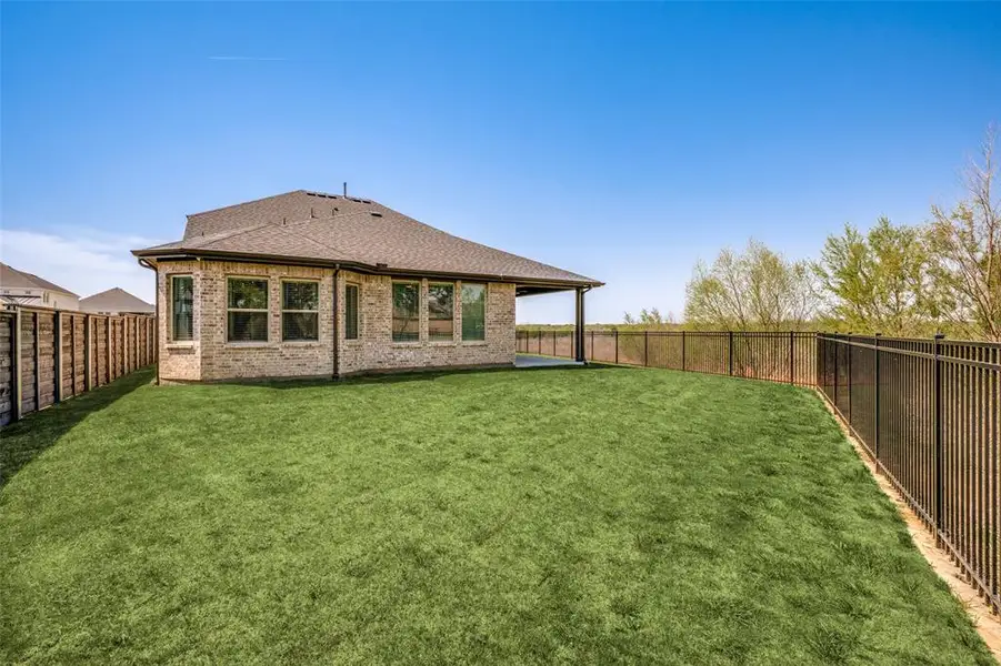 Exterior details and patio area of a home in , Little Elm (Image 2). Exterior details and patio area of a home in , Little Elm (Image 2).