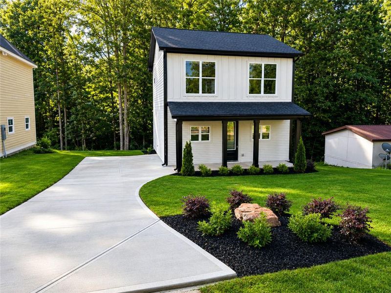 Front exterior of a new home in , Cumming, GA, highlighting curb appeal (Image 19).