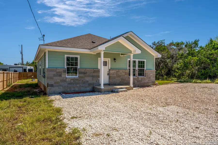 Front exterior of a new home in , Canyon Lake, TX, highlighting curb appeal (Image 2).