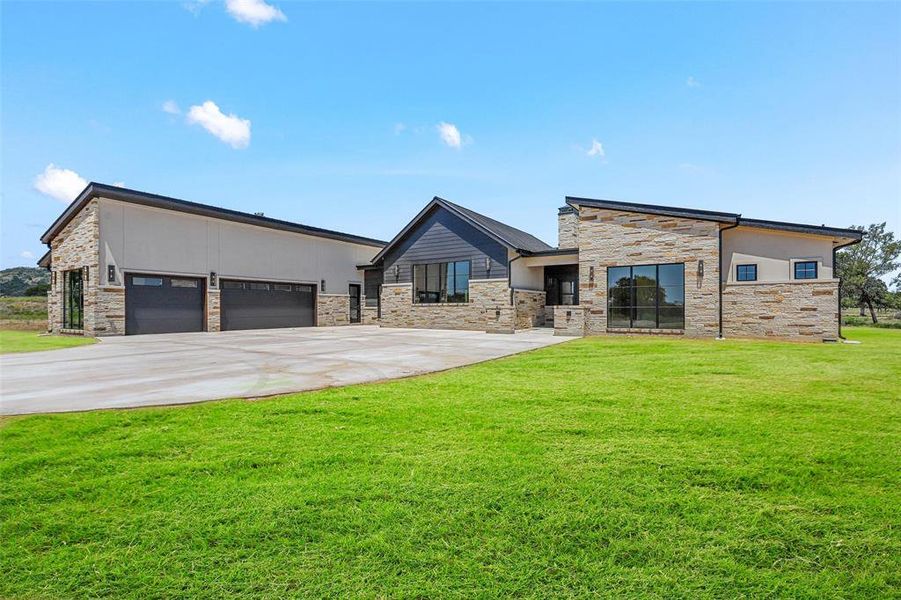 Front exterior of a new home in , Strawn, TX, highlighting curb appeal (Image 21). Front exterior of a new home in , Strawn, TX, highlighting curb appeal (Image 21).