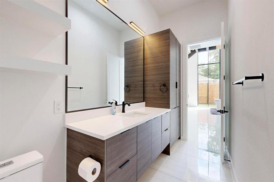 Bathroom featuring vanity and tile patterned floors Bathroom featuring vanity and tile patterned floors