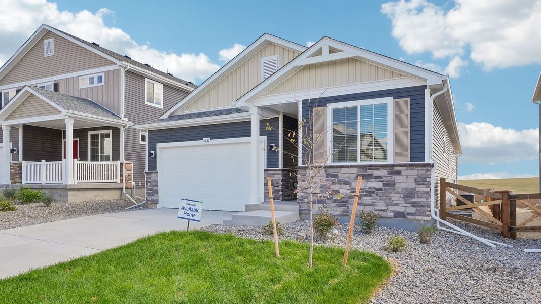 Front exterior of a new home in Banning Lewis Ranch, Colorado Springs, CO, highlighting curb appeal (Image 2). Front exterior of a new home in Banning Lewis Ranch, Colorado Springs, CO, highlighting curb appeal (Image 2).