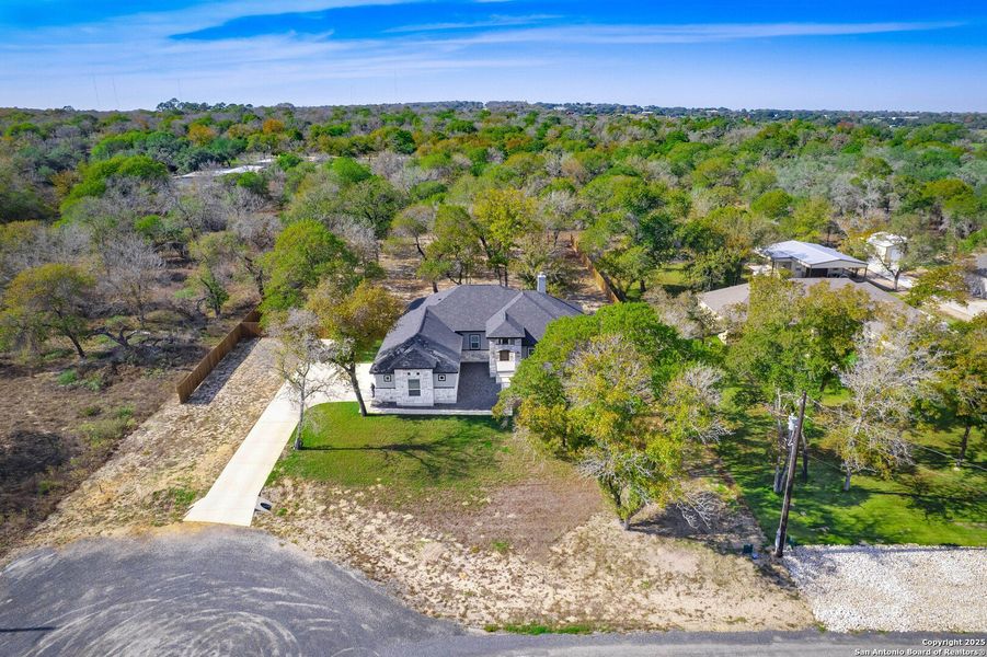 Front exterior of a new home in , La Vernia, TX, highlighting curb appeal (Image 1). Front exterior of a new home in , La Vernia, TX, highlighting curb appeal (Image 1).