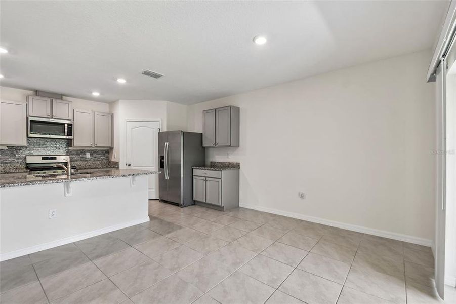 Furnished interior view inside a new home in Riviera Bella, Debary (Image 9).
