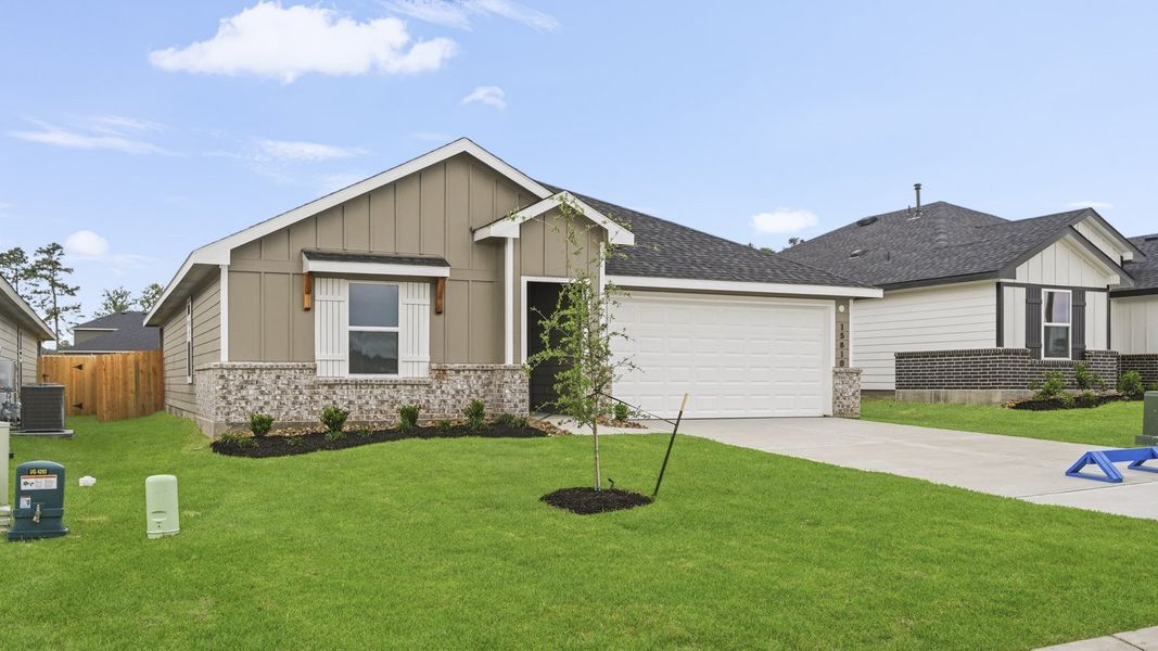 Front exterior of a new home in Chapel Lakes, Montgomery, TX, highlighting curb appeal (Image 18).