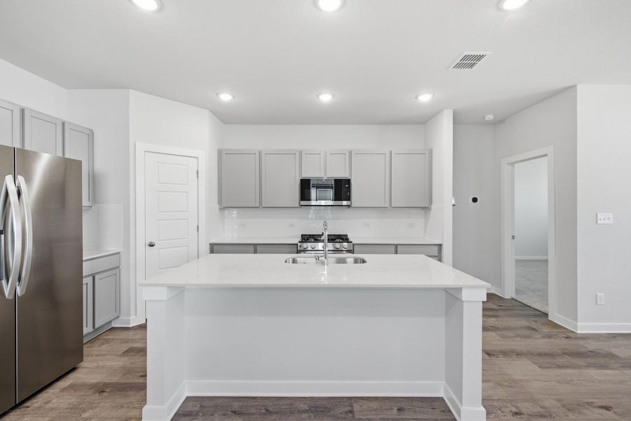 Furnished interior view inside a new home in Stallion Run, Buda (Image 17).