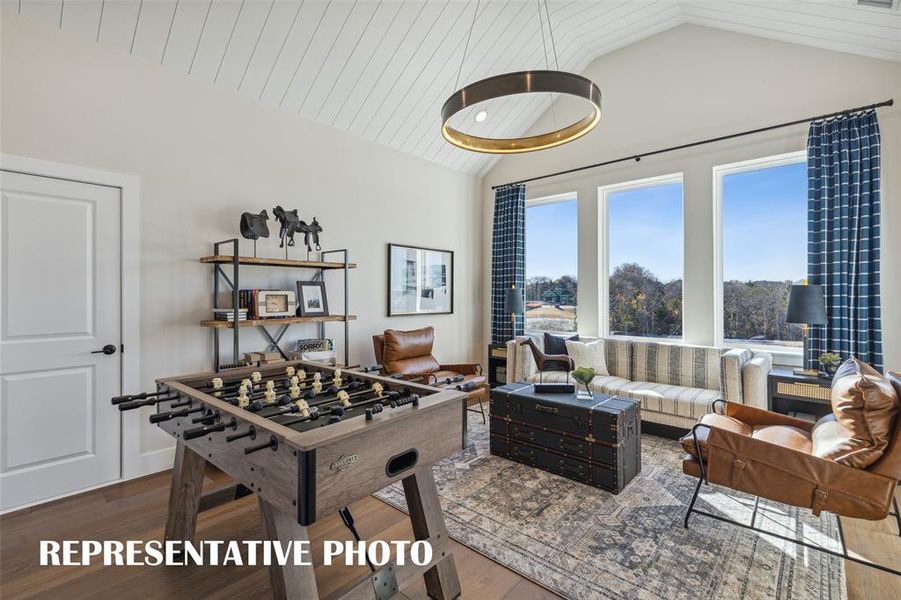 The entire family will enjoy hours of fun time in this light filled game room!  REPRESENTATIVE PHOTO