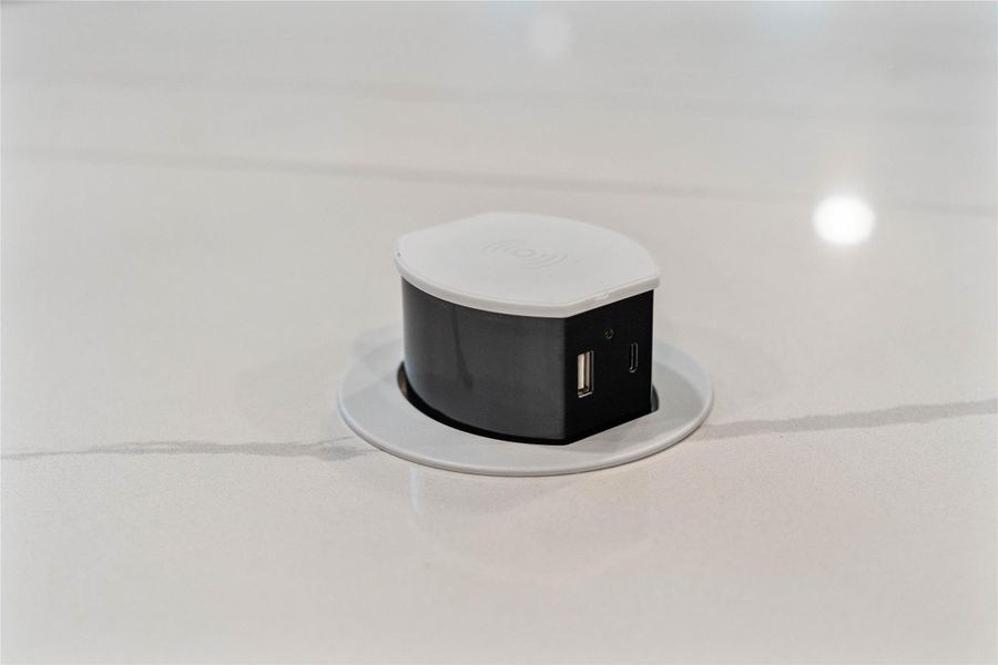 A pop-up outlet on a kitchen island provides a space-saving power solution that eliminates hazardous dangling cords while maintaining the clean, uninterrupted aesthetic of your countertop. A pop-up outlet on a kitchen island provides a space-saving power solution that eliminates hazardous dangling cords while maintaining the clean, uninterrupted aesthetic of your countertop.