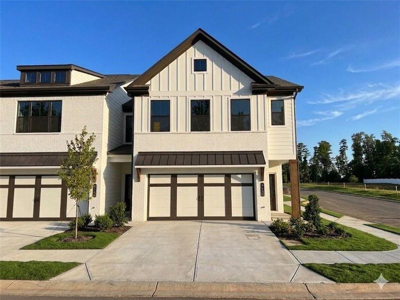 Front exterior of a new home in Millstone at Mundy Mill, Gainesville, GA, highlighting curb appeal (Image 1). Front exterior of a new home in Millstone at Mundy Mill, Gainesville, GA, highlighting curb appeal (Image 1).