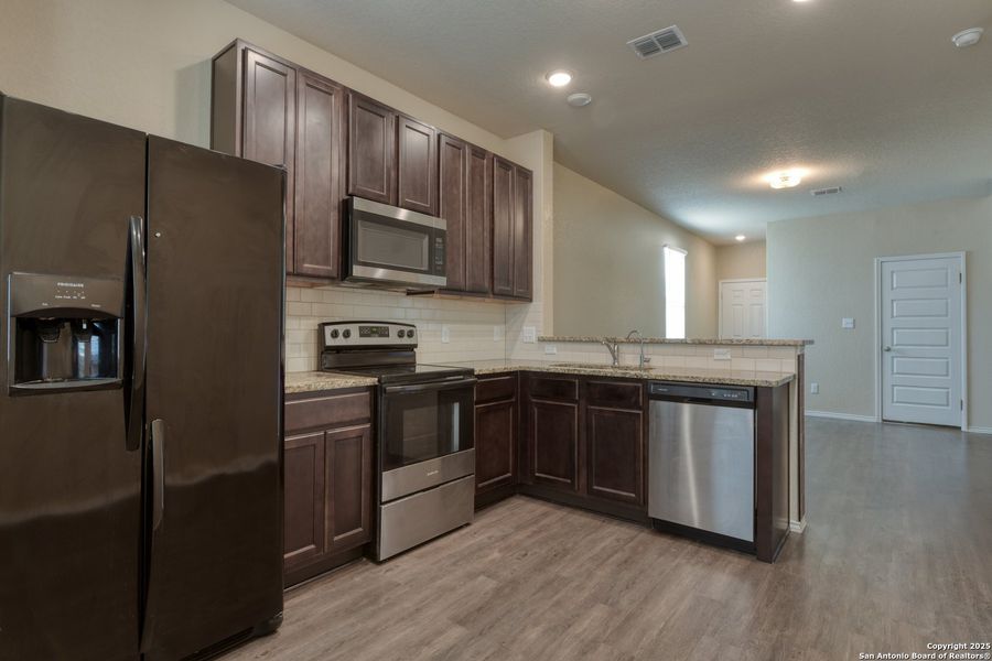 Furnished interior view inside a new home in Somerset Trails, San Antonio (Image 6).