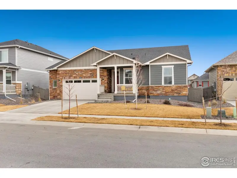 Front exterior of a new home in Vantage, Berthoud, CO, highlighting curb appeal (Image 1). Front exterior of a new home in Vantage, Berthoud, CO, highlighting curb appeal (Image 1).