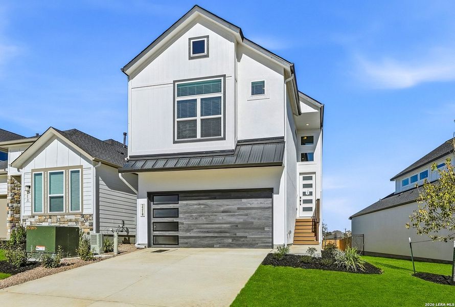 Front exterior of a new home in Prominence, San Antonio, TX, highlighting curb appeal (Image 24).