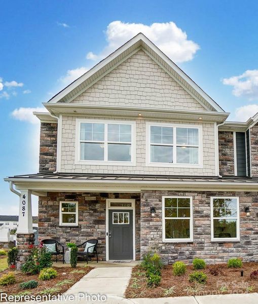 Homesite 143 features an end-unit Cary floorplan.