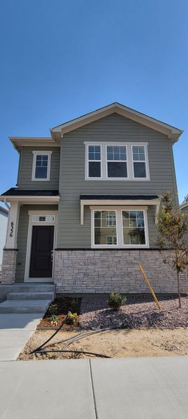 Front exterior of a new home in Revel Crossing at Wolf Ranch – The Ascent Collection, Colorado Springs, CO, highlighting curb appeal (Image 1). Front exterior of a new home in Revel Crossing at Wolf Ranch – The Ascent Collection, Colorado Springs, CO, highlighting curb appeal (Image 1).