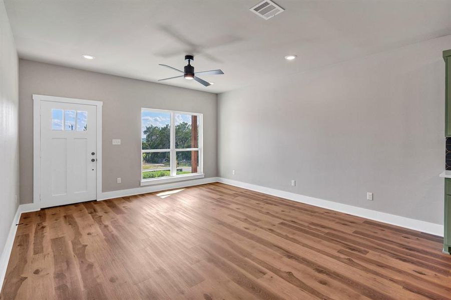 Entryway featuring wood finished floors, ceiling fan, and recessed lighting Entryway featuring wood finished floors, ceiling fan, and recessed lighting