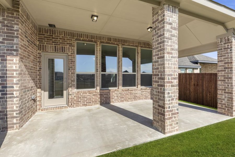 Representative exterior photo of a completed home built from the Kingston by Impression Homes in Arcadia Trails, Balch Springs, TX (Image 7).