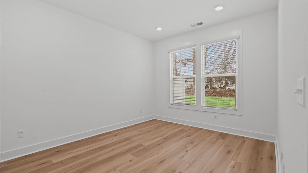 Eye-catching details and elegant finishes in the vibrant primary suite of this select villa at Pelham Crossing