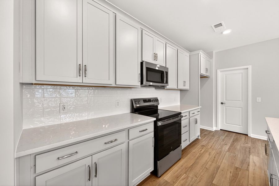 Furnished interior view inside a new home in Amplitude, Charlotte (Image 9).