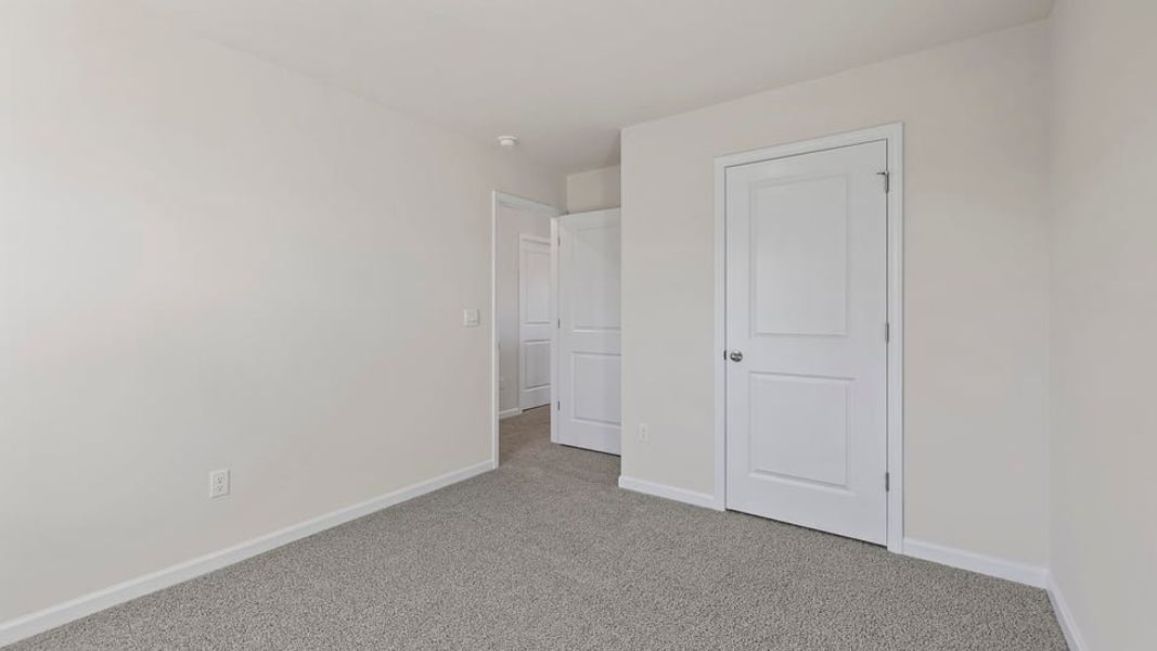 Spacious, unfurnished interior of a new home in Bentley Park, Greenwood (Image 26).