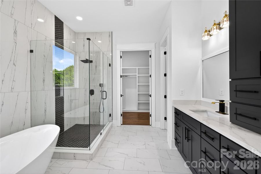 A soaking tub, oversized shower, and a layout that makes everyday routines feel slower, calmer, and a little more enjoyable