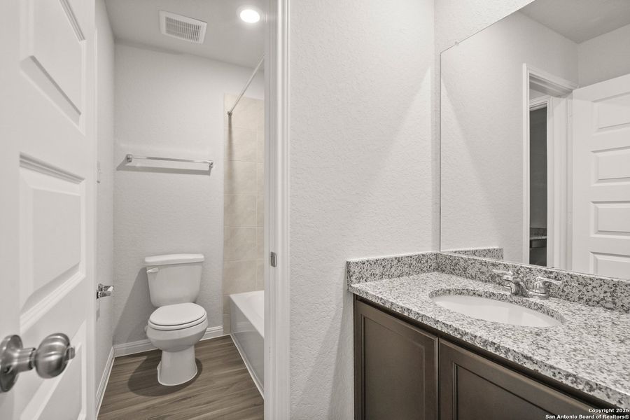 Furnished interior view inside a new home in Cinco Lakes, San Antonio (Image 10).