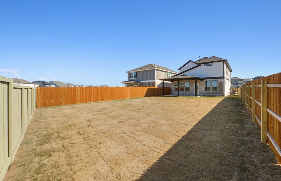 Exterior details and patio area of a home in Santa Rita Ranch, Liberty Hill (Image 23).