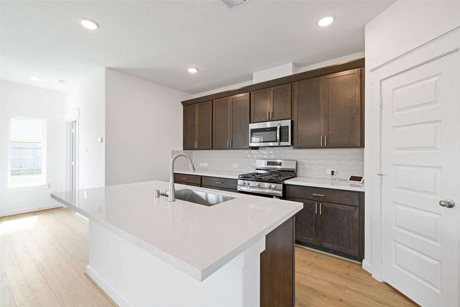Furnished interior view inside a new home in Sunterra, Katy (Image 6).