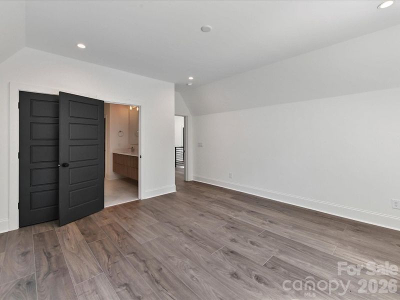 Spacious third bedroom with easy access to the Jack-and-Jill bathroom and plenty of room for guests, family, or a home office.