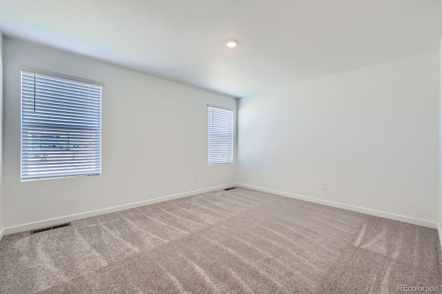 Spacious, unfurnished interior of a new home in Copper Chase: The Celestial Collection, Colorado Springs (Image 13).