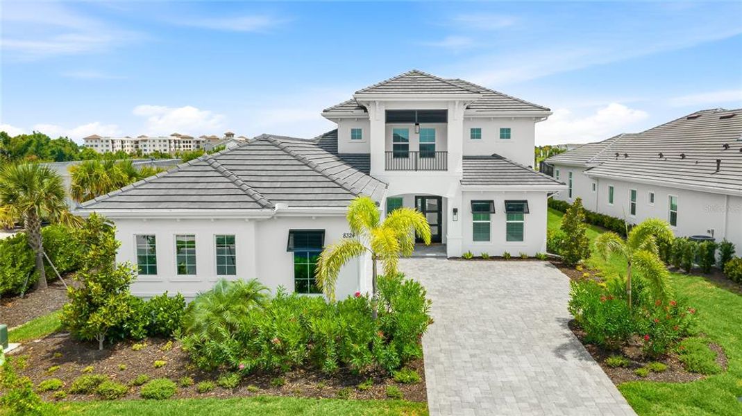 Front exterior of a new home in , Sarasota, FL, highlighting curb appeal (Image 26).